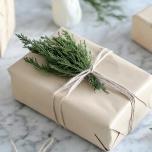 elegant-gifts-wrapped-brown-paper-with-twine-greenery-marble-tabletop-display_937679-67089